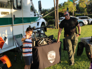 PBSO official with boy
