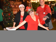Child and family smiling after seeing Santa