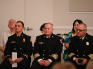 Assistant Fire Marshal Wallwork, Chief Konz and Chief Fuller listen in to a presentation.