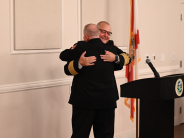 Chief Fuller embracing Chief Konz with a hug.