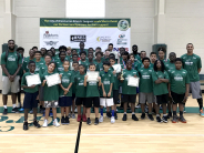 Co-ed summer basketball camp group picture with coaches