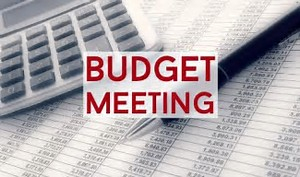 Image of Calculator with phrase Budget Meeting in Bold